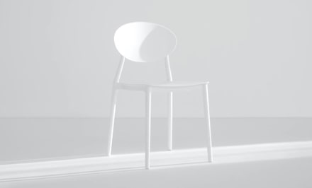Light scene with a white chair